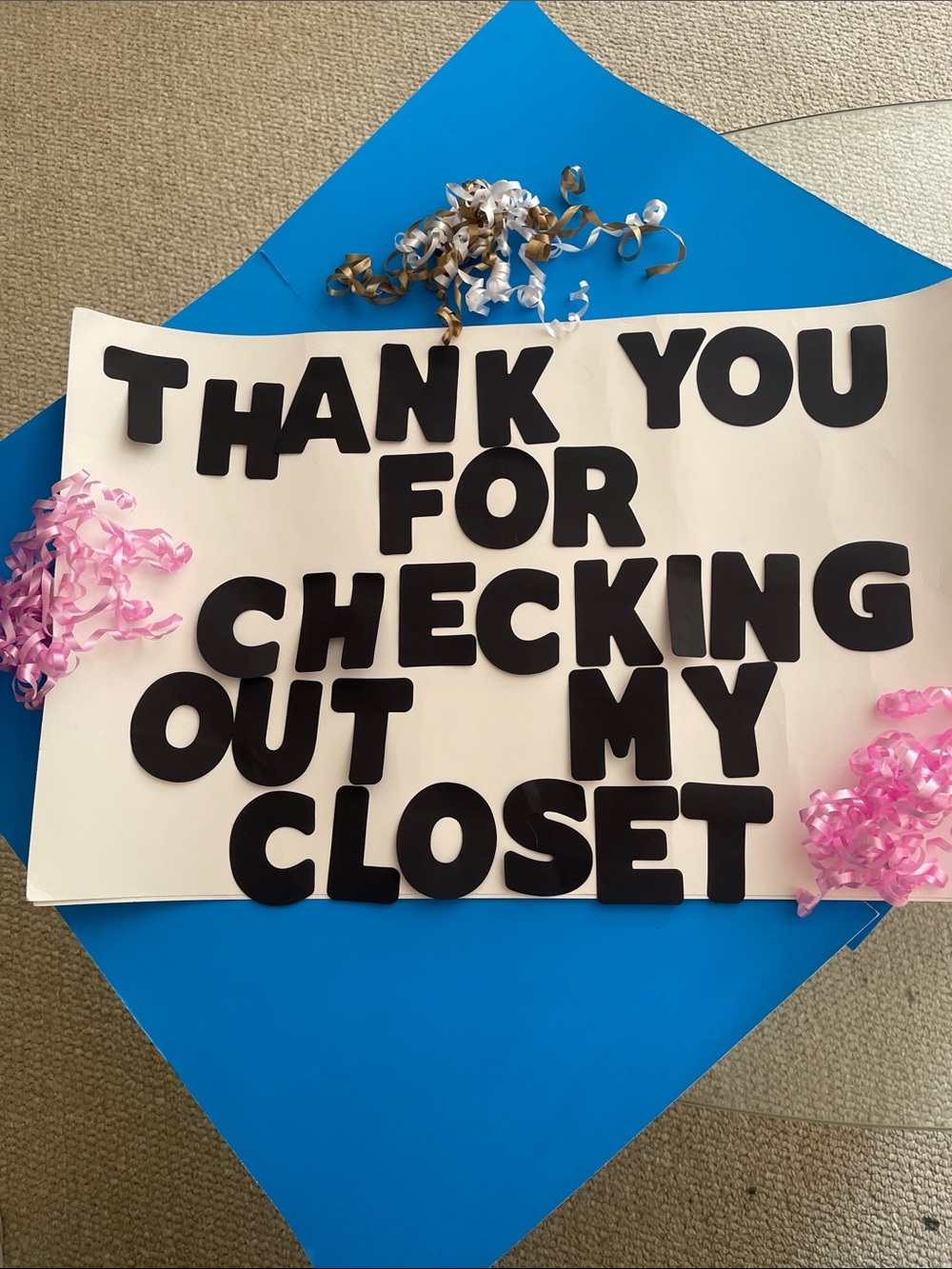 Black Lettering Thank You Sign on Cream Backdrop